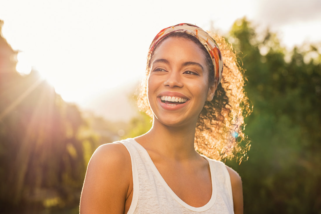 beautiful-girl-with-curly-hair-wearing-hat-summer-hair-care-concept