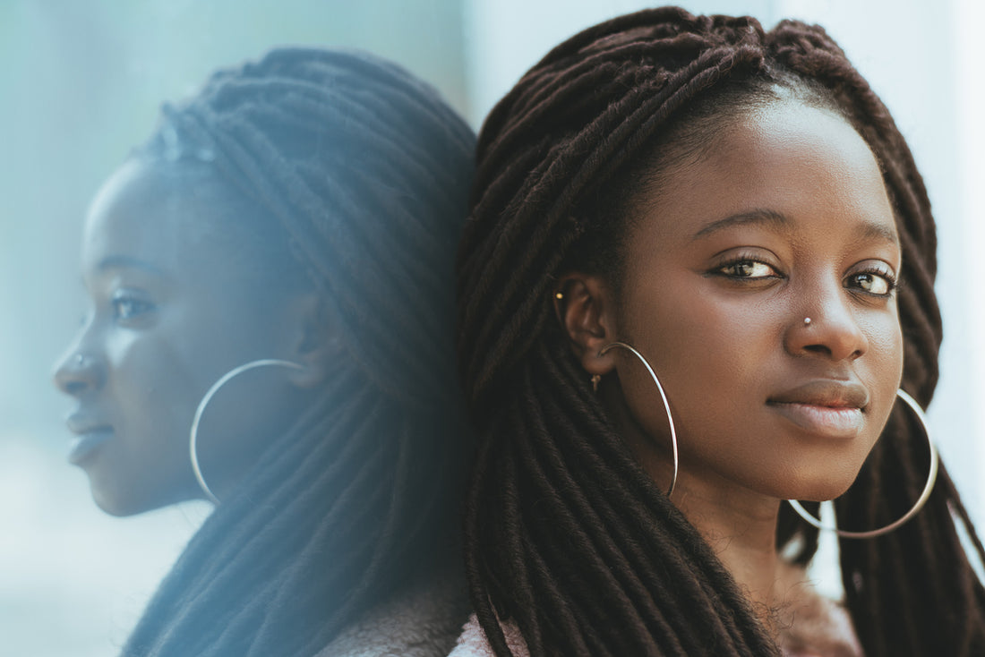 woman-with-locs-and-huge-earrings-protective-style-concept