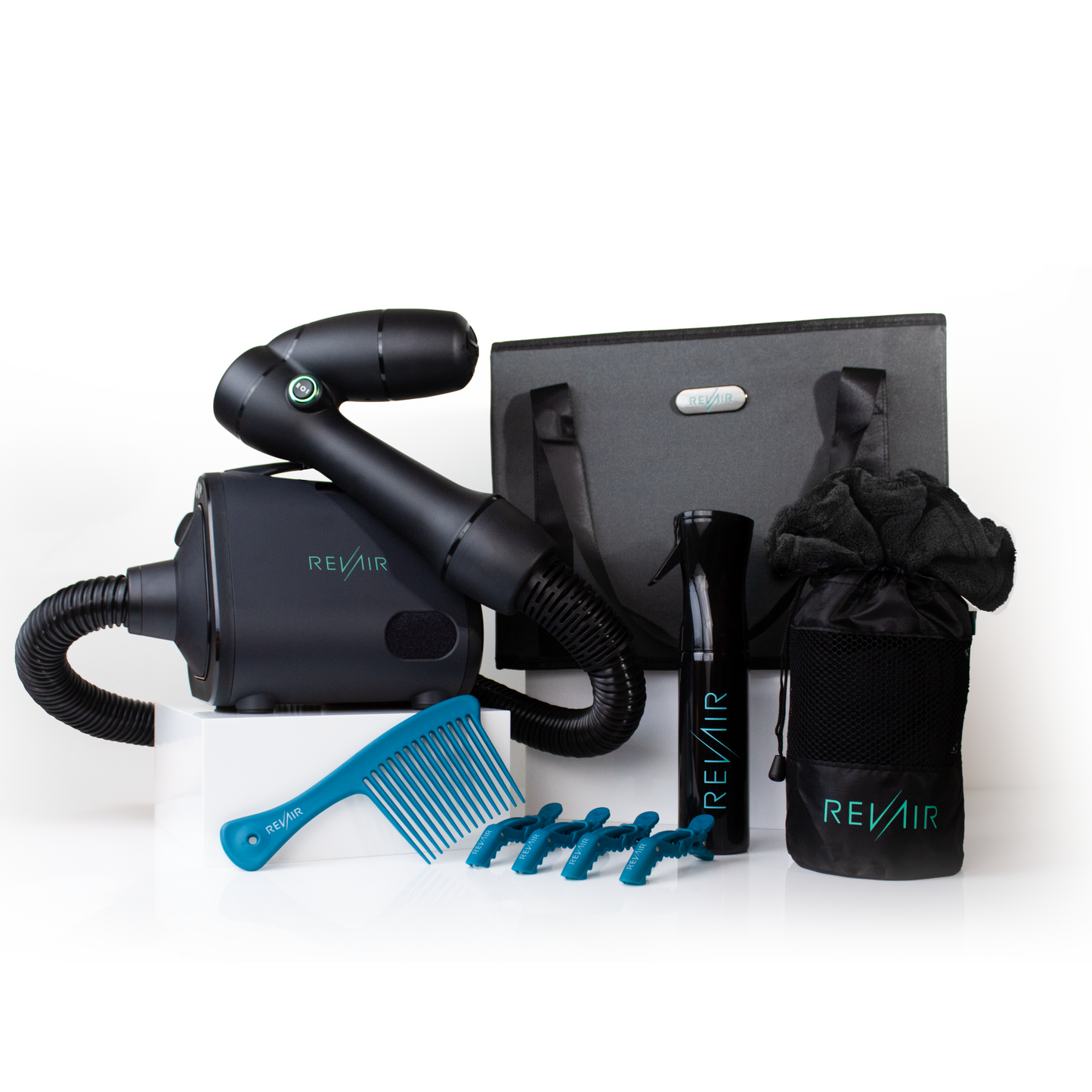RevAir Total Package bundle featuring Reverse-Air Dryer, Store & Tote Bag, Continuous Mist Spray Bottle, Mesh Well Accessory Bag, Bundle Up Hair Towel, The Wright Comb, and Up for Grabs Sectioning Clips.
