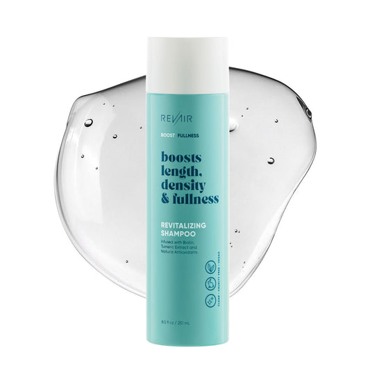 RevAir revitalizing shampoo product bottle with a puddle of shampoo gel behind it showing clear color