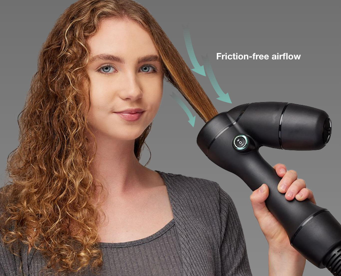 Woman with curly hair using the RevAir wand, with the words: Friction-free airflow and arrows showing reverse air direction