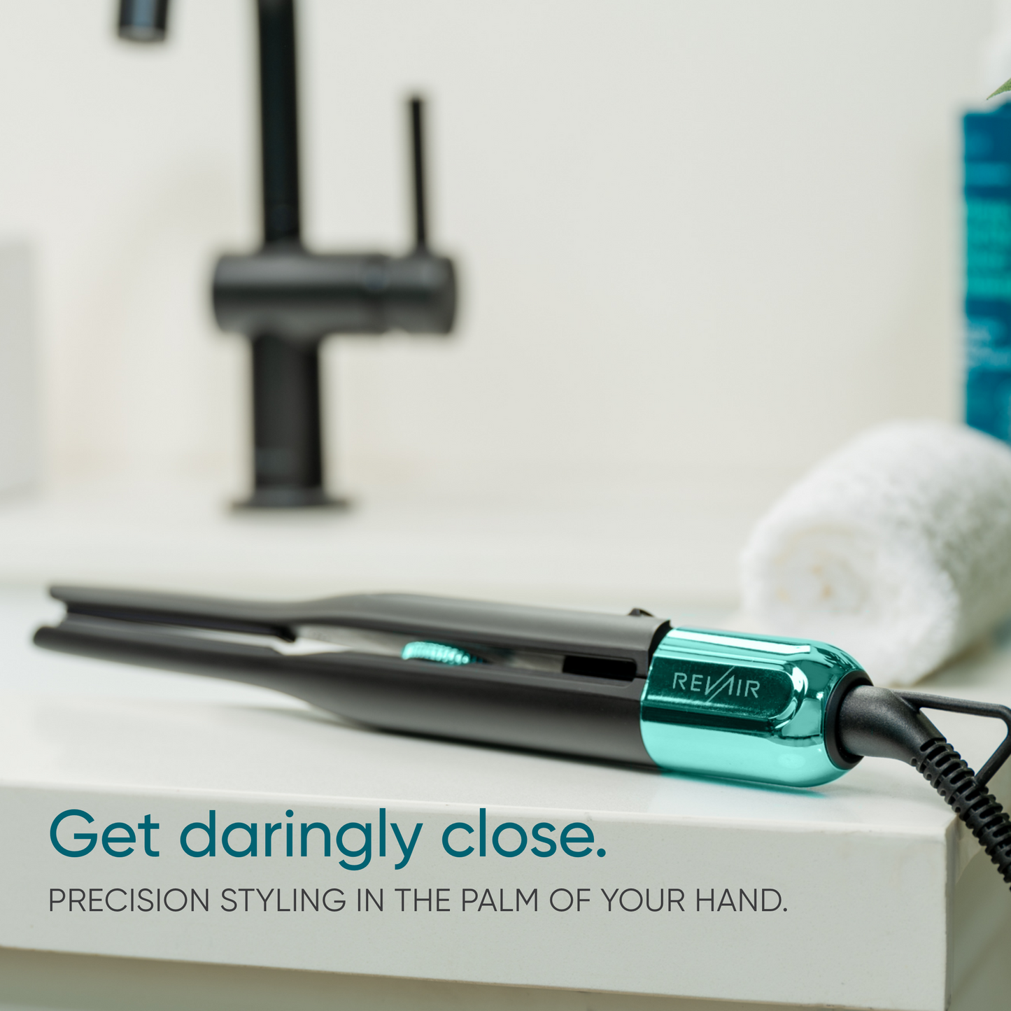 RevAir Micro Edge Styler hair straightener resting on bathroom counter, slim design for precision styling in tight areas.