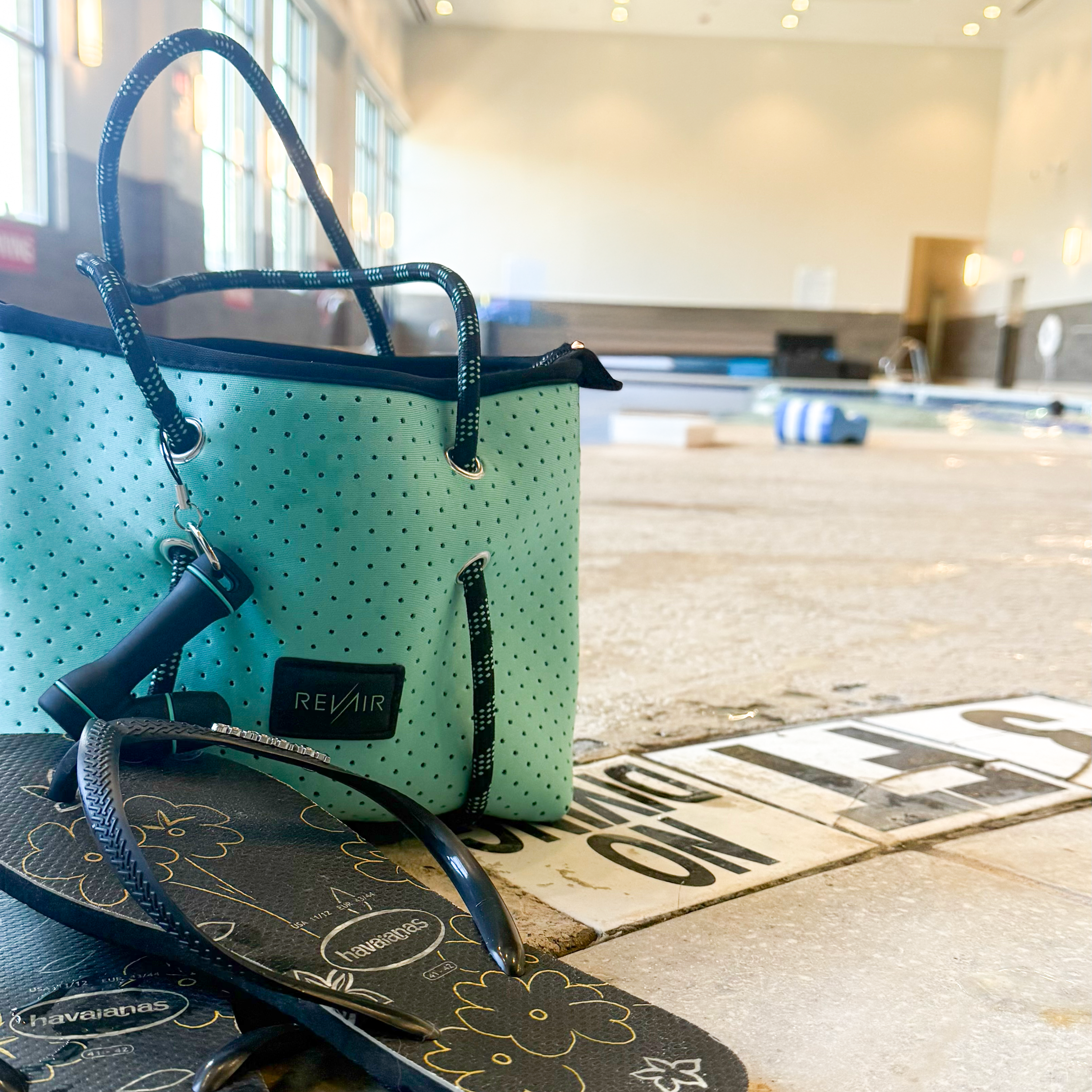 Sidekick tote bag at pool next to flip flops