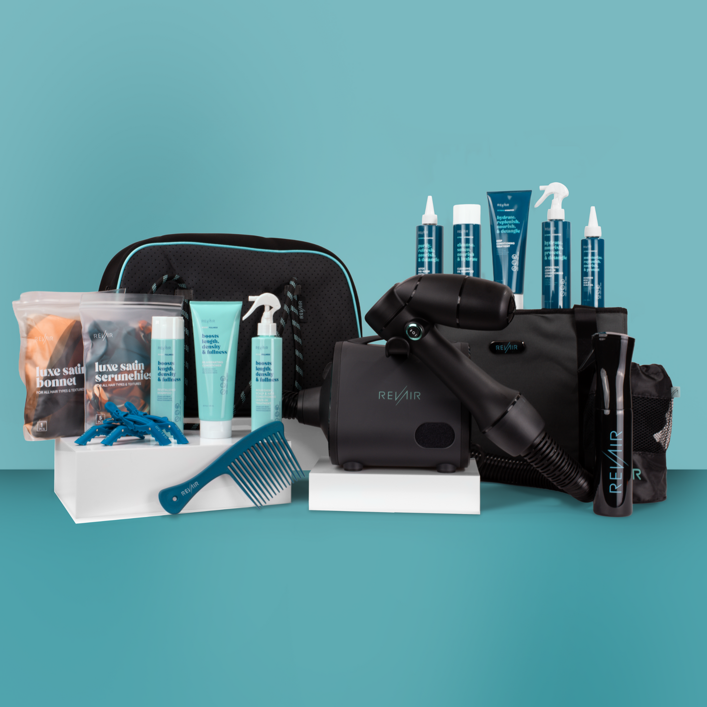 Large collection of RevAir hair care products and accessories surrounding RevAir hair dryer