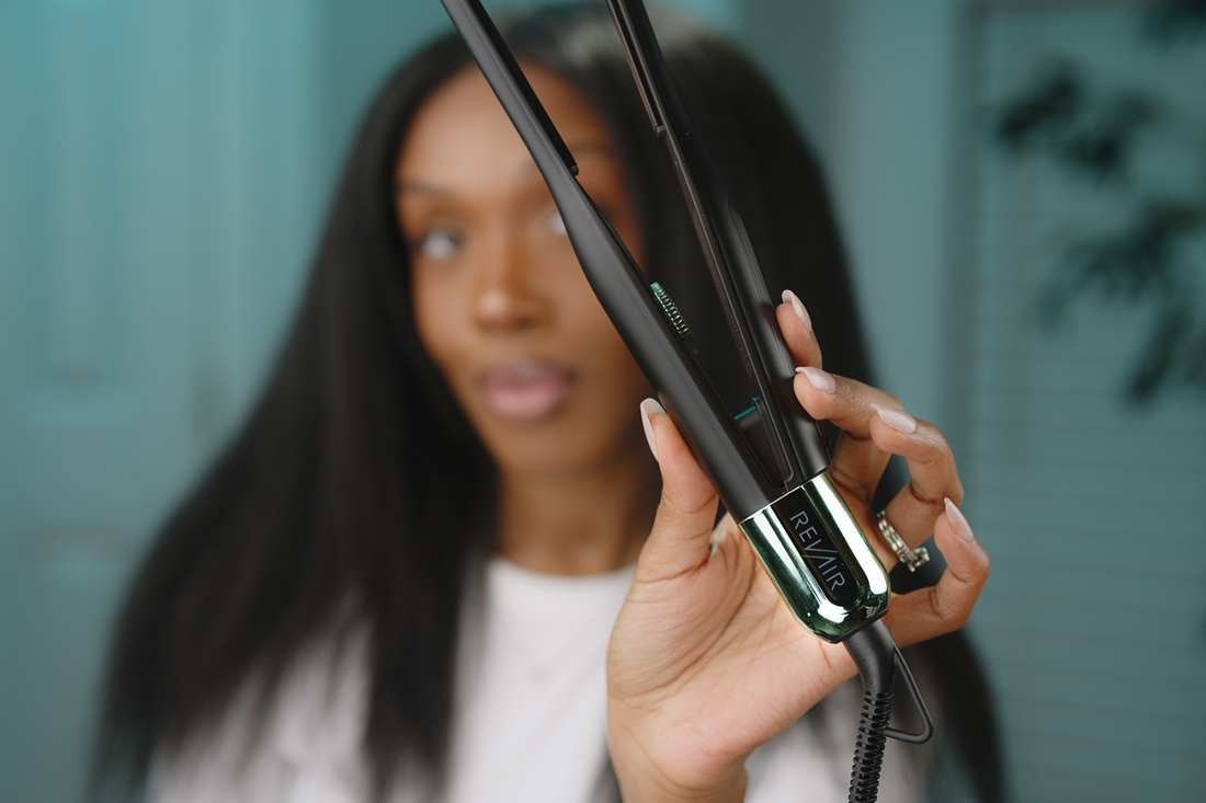 Woman holding the RevAir Micro Edge Styler, showcasing the slim plates designed for precision styling and detail work.