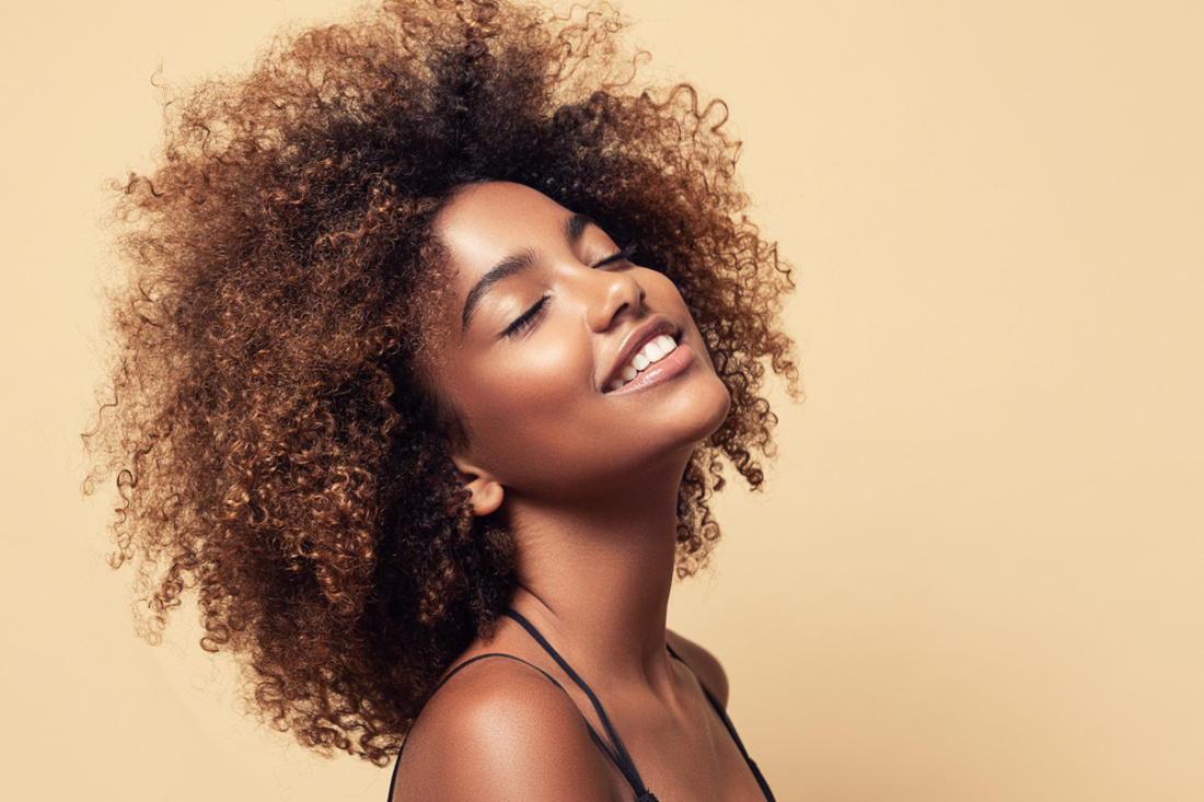 young-female-model-with-beautiful-curly-hair-high-porosity-hair-concept