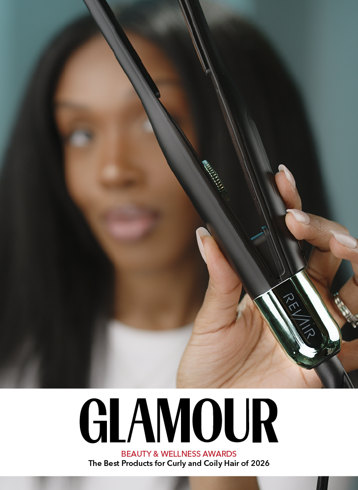 A Black woman with long straight hair holding the RevAir Micro Edge Styler up close, with the Glamour Beauty and Wellness Awards logo and the text The Best Products for Curly and Coily Hair of 2026 displayed below