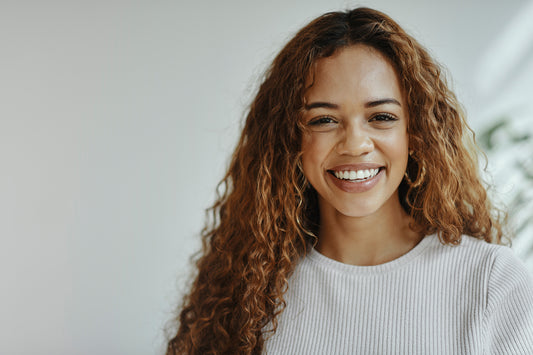 cheerful-woman-with-curly-hair-healthy-scalp-concept