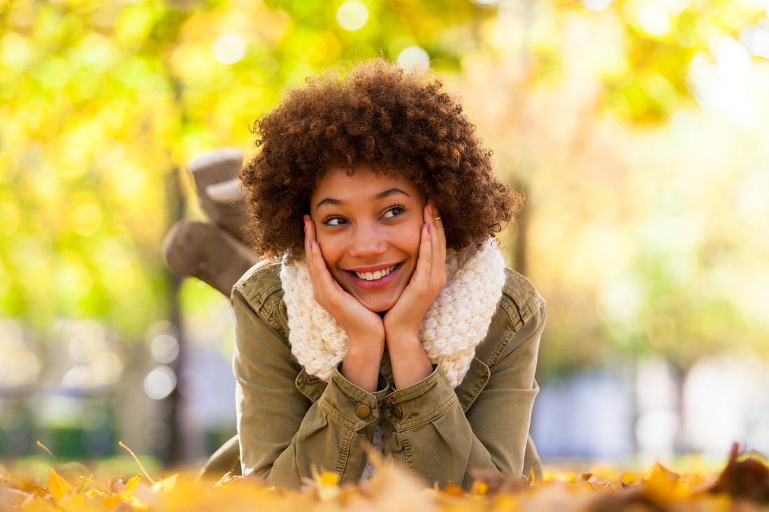 woman-laying-on-the-ground-during-fall-hair-care-concept