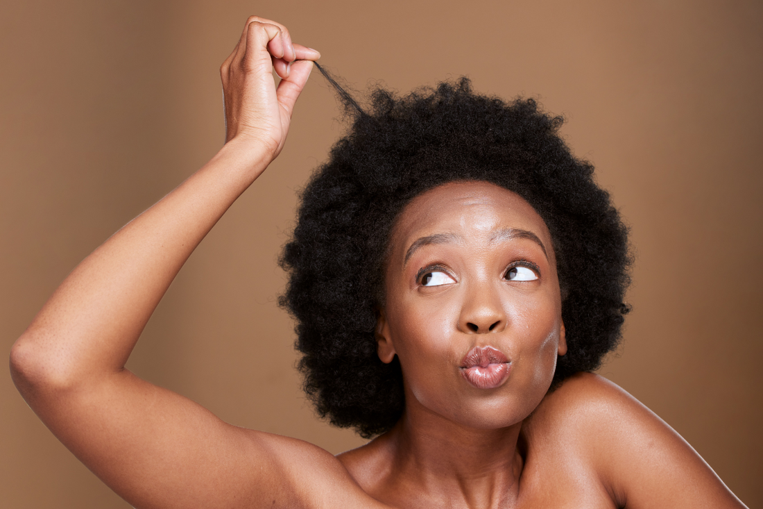 woman-with-hand-in-hair-scalp-detox-concept