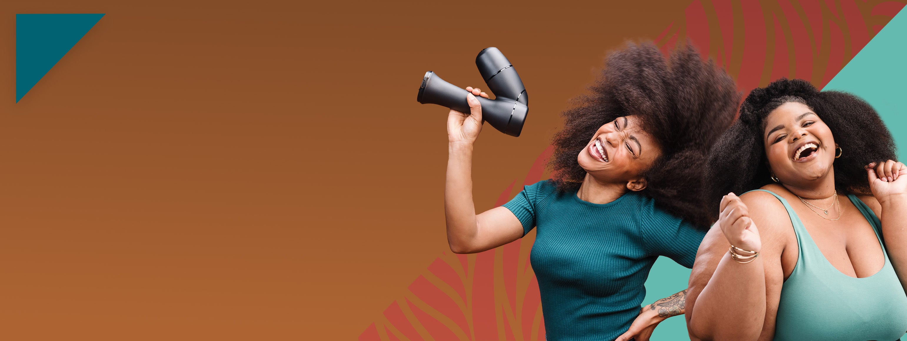 Two women with styled hair laughing and dancing while one holds a RevAir wand