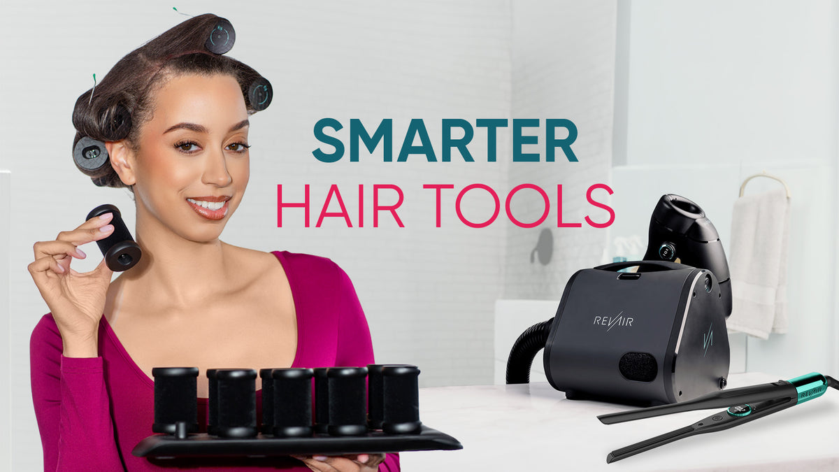 A woman with dark hair in curlers holds a black curling tool next to a black RevAir hair dryer and flat iron on a white counter, with the text smarter hair tools overlaid on the image.