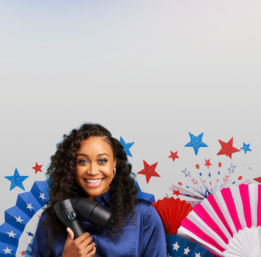 Smiling woman holding RevAir wand with patriotic starbursts in the background