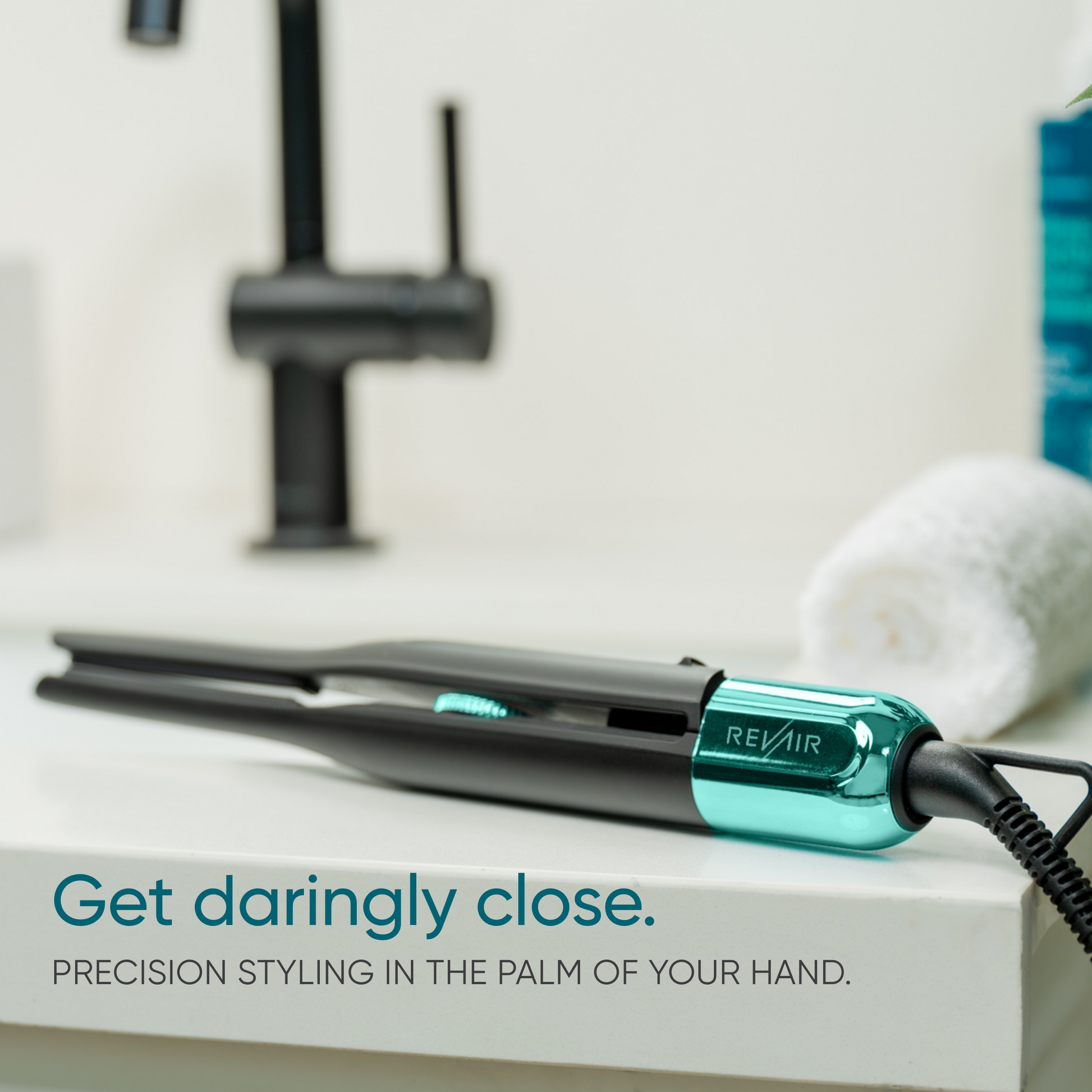 RevAir Micro Edge Styler hair straightener resting on bathroom counter, slim design for precision styling in tight areas.