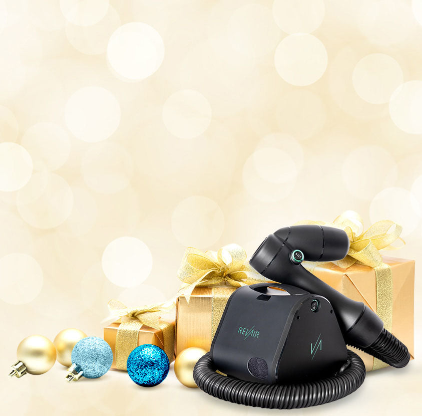 RevAir hair dryer with a gold gift box and holiday ornaments