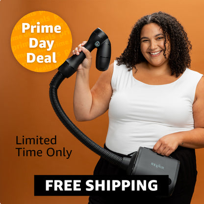 Woman holding a RevAir Wand with promotional text about a Prime Day deal and free shipping on an orange background.