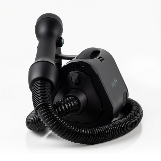 RevAir black device with hose and wand on white back ground, Wand sitting on wand rest