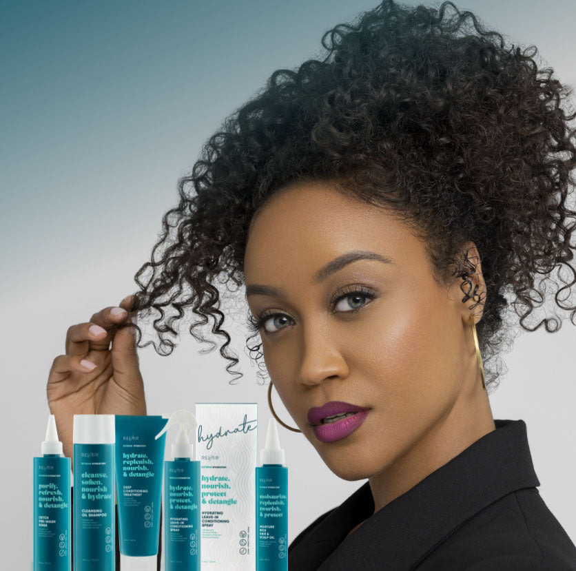 Woman with type 4 hair holding out a strand of her hair, showing its coily texture, with group of RevAir extreme hydration product bottles superimposed on image